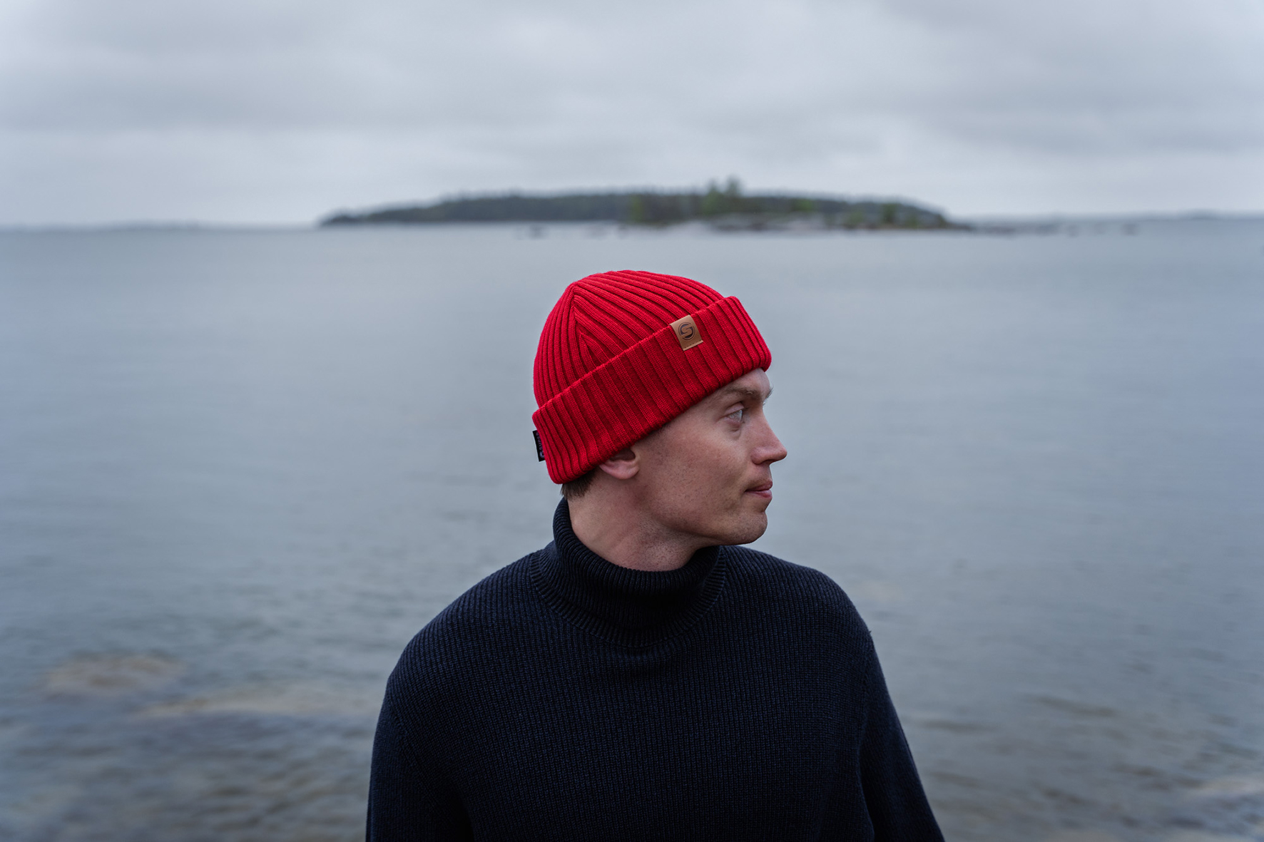 SAILOR Red A man wearing a red cousteau beanie